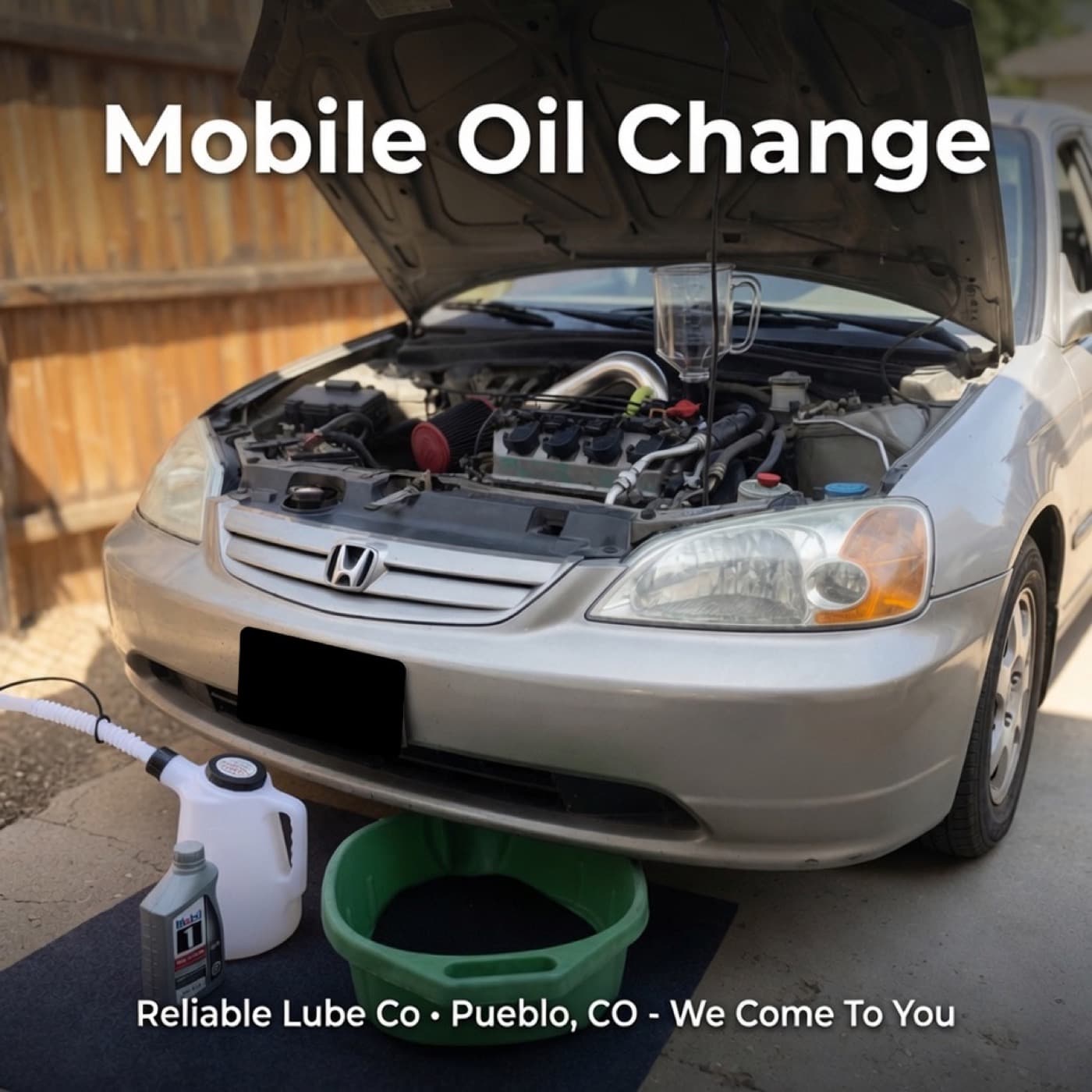 Mobile oil change on sedan